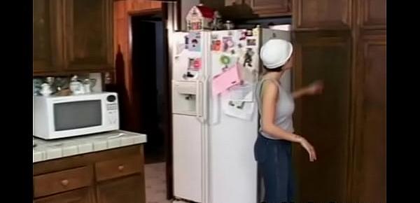  Lesbian dildo fucking in the kitchen